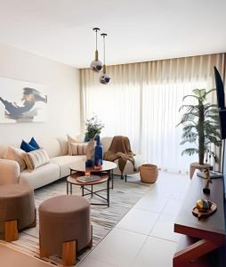 a living room with a couch and a table at Gardenia in Punta Cana