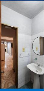 a bathroom with a sink and a mirror at Departamento PL in Paso de los Libres +19 photos