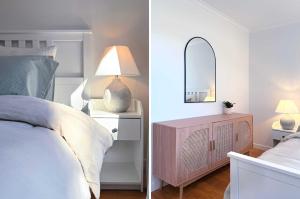 Clarendonにある4BR Retreat Near McLaren Vale Wineries Adelaideのベッドルーム(ランプ、鏡付)