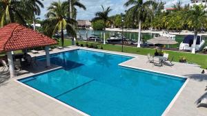 a pool with a view of a marina at Luxury Holiday Apartment by the Lagoon in Cancún