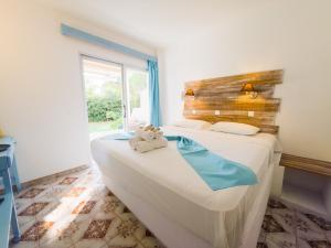 Ένα ή περισσότερα κρεβάτια σε δωμάτιο στο Trees Art Hotel & Suites