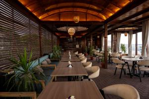 a row of tables and chairs in a restaurant at The Bedouin Moon in Dahab