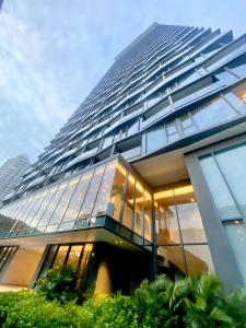 a tall building with a lot of windows at arom wongamat in Pattaya North