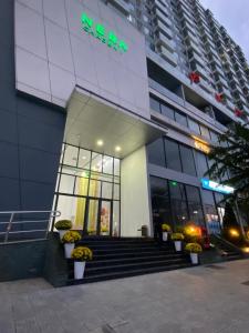 a store front of a building with a sign on it at Thương Apartment 1 in Thôn Văn Dương