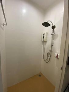 a bathroom with a shower with a light on the wall at ขุนโลหะ K̄hun loh̄a in Phuket +124 photos