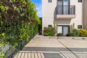 a building with a balcony and a fence at Stanza Bucerias Condos - Pool Parking & Near Beach in Bucerías