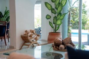 a room with a table with a bowl of mushrooms at Casa Coco - 4BR | Private Pool | Hotel Zone in Cancún