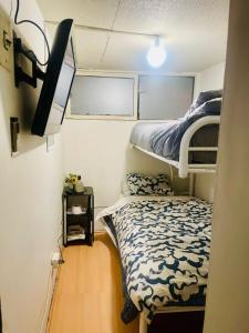 Una cama o camas en una habitación de Alojamiento Latadia Las Condes