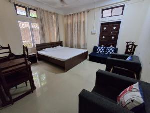 Postel nebo postele na pokoji v ubytování Dorika Homestay, Guwahati