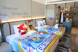 Letto o letti in una camera di EVEN Hotel Yining