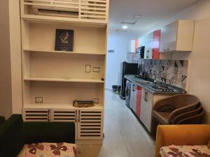 a room with a kitchen with a counter and a stove at بورتو مطروح ألهاني families only in Marsa Matruh