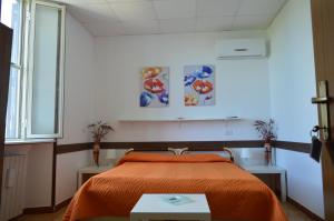מיטה או מיטות בחדר ב-Albergo Ollolai