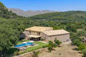 an aerial view of a house with a swimming pool at Pontarro in Pollença
