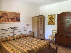 a bedroom with a bed and a painting on the wall at Il Girasole in Venturina Terme +31 photos