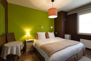 Postel nebo postele na pokoji v ubytování Guesthouse Amfora + 9 fotografií