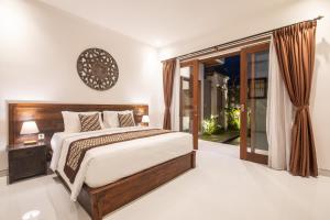 Postel nebo postele na pokoji v ubytování 6 Bedrooms Private Pool Villa Cemagi