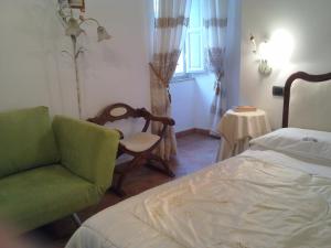 Un pat sau paturi într-o cameră la B&B Casa Delle Rose