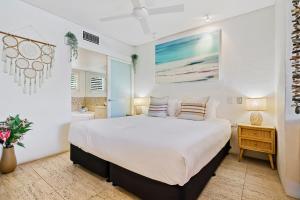 a bedroom with a large bed and a bathroom at Noosa Blue Resort in Noosa Heads +164 photos