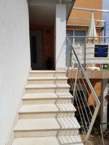 a set of stairs leading to a house at Apartment Lency in Novigrad Istria