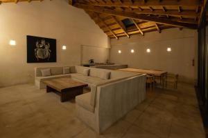 a living room with a couch and a table at Jungla Hotel Boutique in San Cristóbal de Las Casas