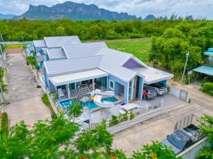an aerial view of a house with a swimming pool at BAN SINGH TO Poolvilla in Cha Am
