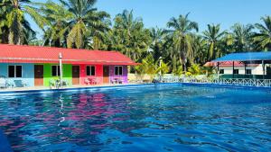 a swimming pool in front of a resort at Capital O 91191 Chalet Cd Impiana in Kulim