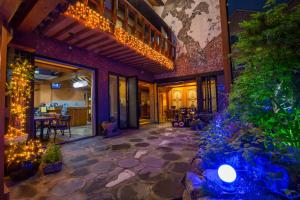 a lobby of a building with lights and plants at Ddlanchae Guesthouse - New Tower in Jeonju
