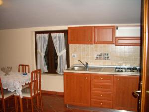 Kuchyň nebo kuchyňský kout v ubytování Hotel Ristorante Fiorelli