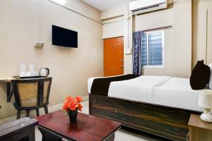 Super Collection O NIT More Adityapur Formerly Hotel Subheksha客房内的一张或多张床位
