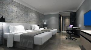Postel nebo postele na pokoji v ubytování Shenzhen Hanyong Hotel Fuyong Branch