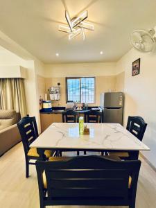 a dining room and kitchen with a table and chairs at 3 BHK Mount Villa by Asmeera Stays in Lonavala