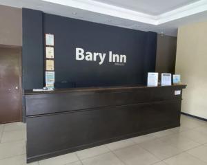 a banny inn sign on a wall in a lobby at Collection O KLIA Formerly Bary Inn in Sepang