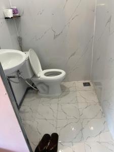 a bathroom with a toilet and a sink at Z Camp Nha Trang in Nha Trang +31 photos