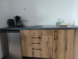 a kitchen with a sink and a counter top at Ferienhaus Hofmann Strüth 7 in Röttingen