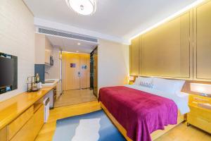 Ένα ή περισσότερα κρεβάτια σε δωμάτιο στο VanHao Serviced Apartment-Zhujiang Newtown-Near the US consulate-Vaperse the same building