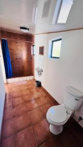 a bathroom with a toilet and a shower at Happy Forest B&B in Katima Mulilo +66 photos