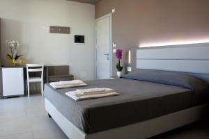 Postel nebo postele na pokoji v ubytování GFH - Hotel Sole Resort & Spa
