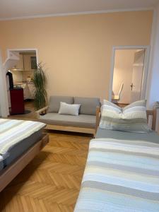 a living room with two beds and a couch at EDI APP Bovec Center-Free Parking & Mountain View in Bovec