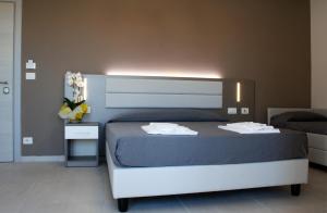 Postel nebo postele na pokoji v ubytování GFH - Hotel Sole Resort & Spa