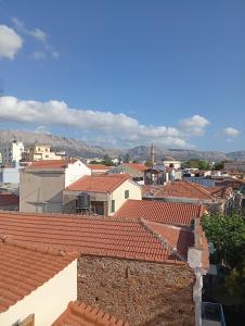 a view of a city with red roofs at Tourni Cozy Chios in Chios +4 photos