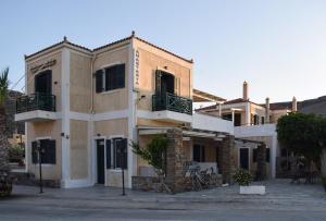 a building with two balconies on the side of it at Anastasia Apartments in Korissia