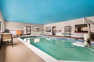 a large pool in a hotel room with at Comfort Inn & Suites North East in North East