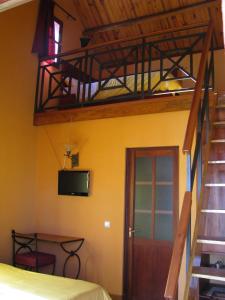 a room with a bunk bed and a staircase at Belvedere Hotel in Antananarivo