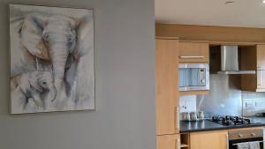 a painting of an elephant on the wall of a kitchen at ANSI Splendor in Livingston