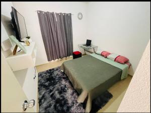 a bedroom with a bed and a television in it at Casa Real Segovia in Huejotzingo +16 photos