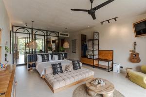 a living room with a bed and a couch at Soulshine Resort Ubud, Bali in Ubud +135 photos