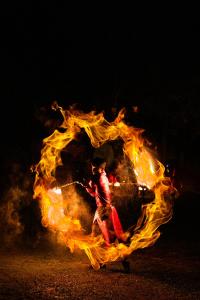 a fire with a person in it with flames at Horizon Resort & Spa Yalong Bay-Yalong Bay Central in Sanya +183 photos