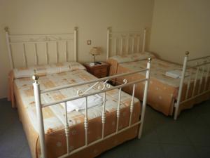 Cama o camas de una habitación en Hostal Miraflor de las Cadenas