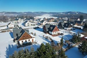 an aerial view of a small town covered in snow at Wellness Chalupa Theo in Vrchlabí