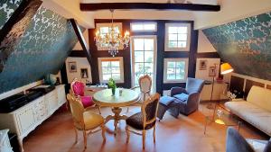 a living room with a table and chairs at Parklife Apartments in Winterberg